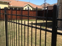 Staggered iron work fence